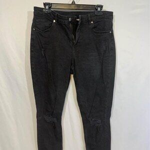 Womans black denim - raw hem. Woman’s size 10. Distressed